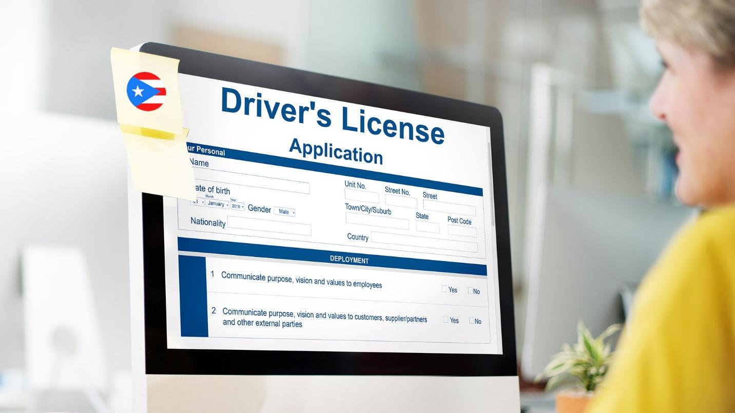 A woman stares at a computer screen that displays a driver’s license application in a section describing the process to obtain a license.