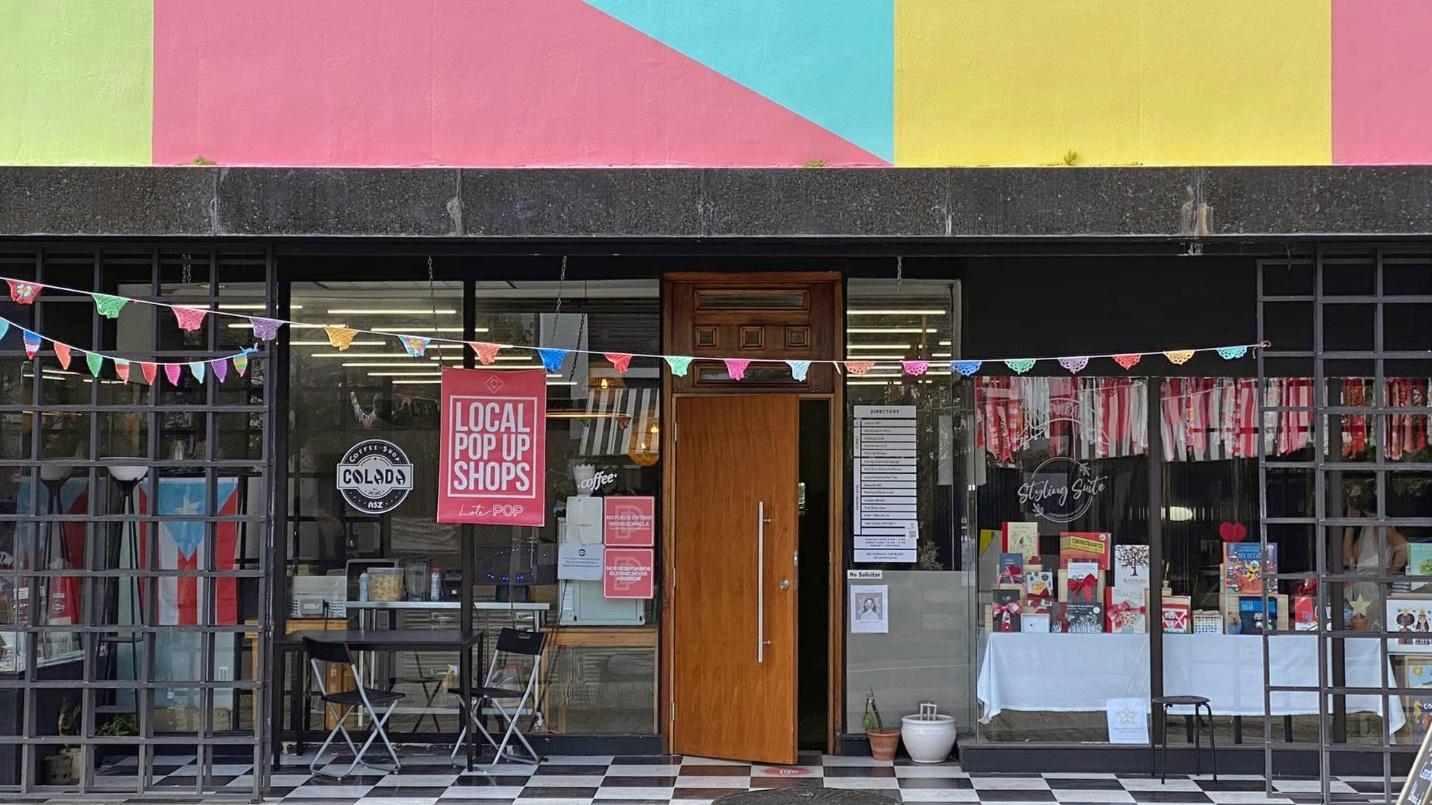 A colorful storefront in a section describing Puerto Rican handicrafts and jewelry at Santurce POP near Condado.
