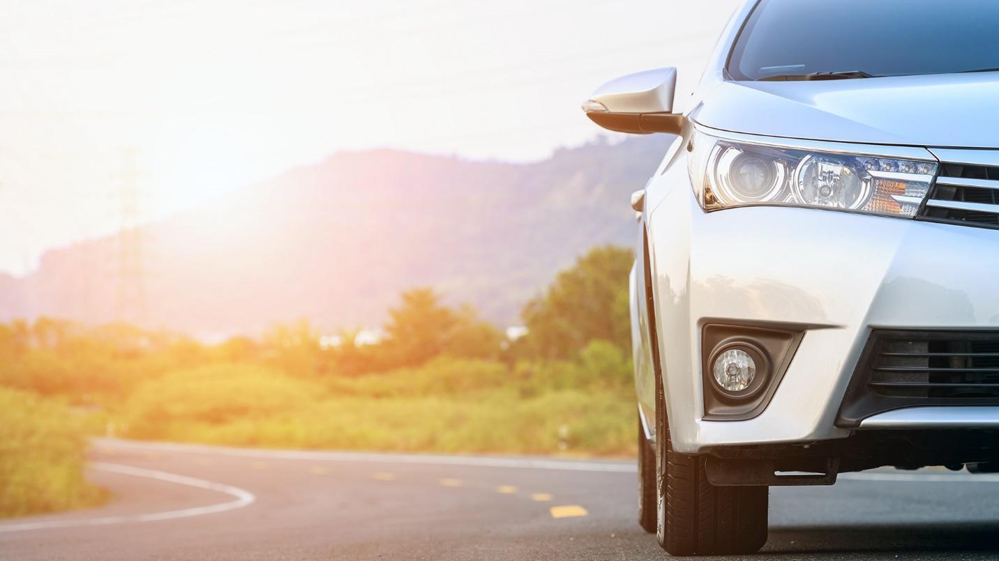 car on a road with a beautiful nature background