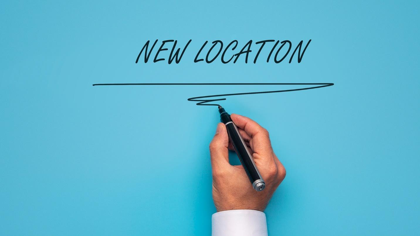 A hand draws and underlines the words “NEW LOCATION” in a section that explains the declaration of non-domicile and how the non-domiciled who have claimed non-dom status pay tax at lower levels on their foreign income.
