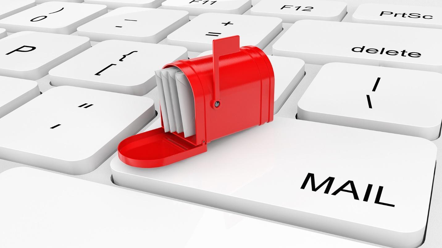 A red mailbox filled with letters rests on a giant keyboard in a section explaining how to set up a virtual mailbox with help from PRelocate.