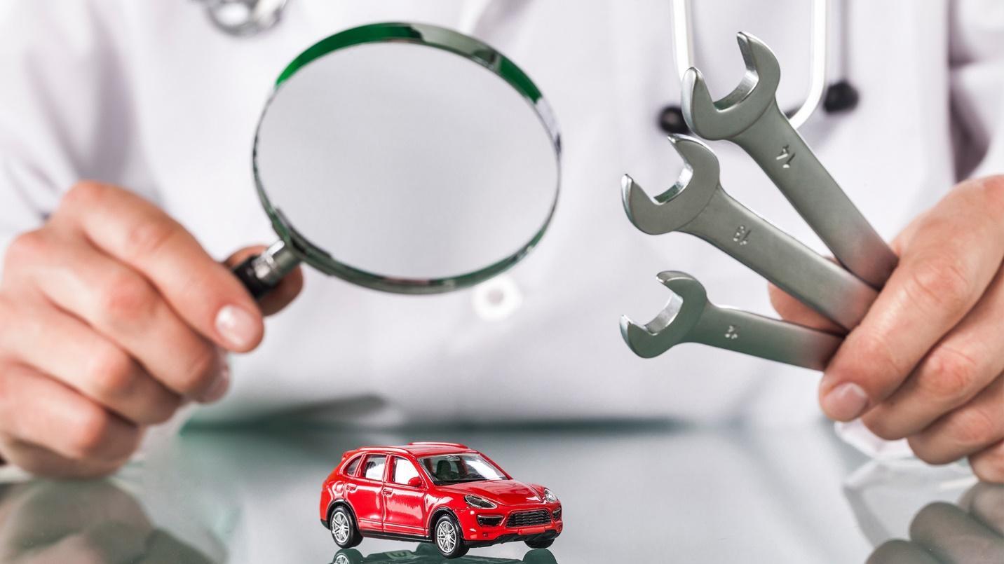 examining a car before buying it
