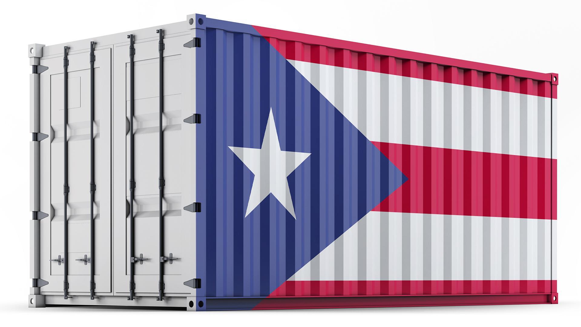A rectangular metal shipping container with the flag of Puerto Rico marked on its long side.