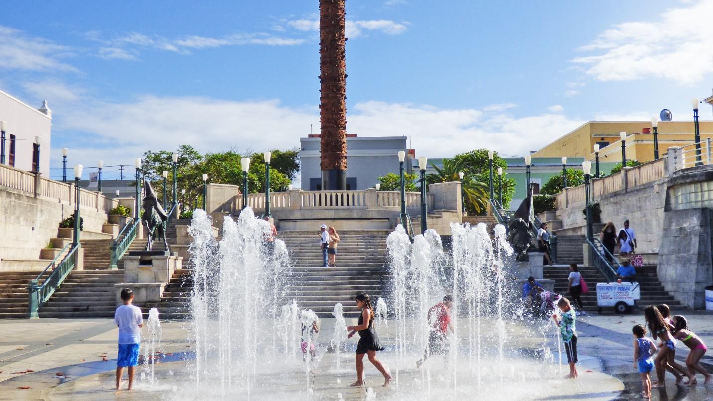 Children play amid jets of water spurting from the ground at Quincentennial Plaza in Old San Juan.
