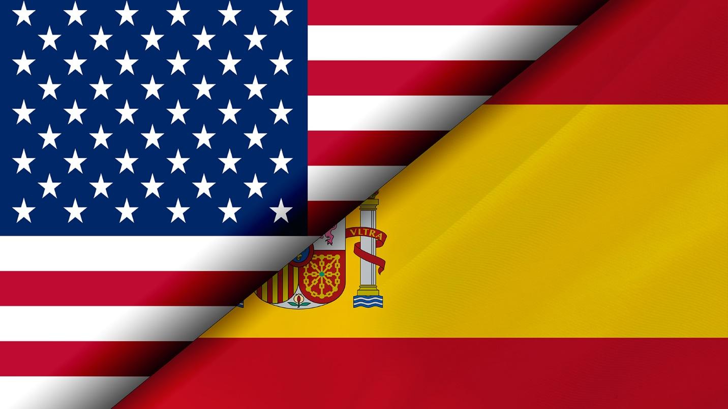 Flags of the United States and Spain.