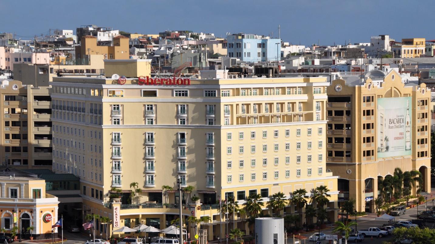 The Sheraton Old San Juan Hotel and surrounding buildings in a section describing the hotel’s amenities and rates. 