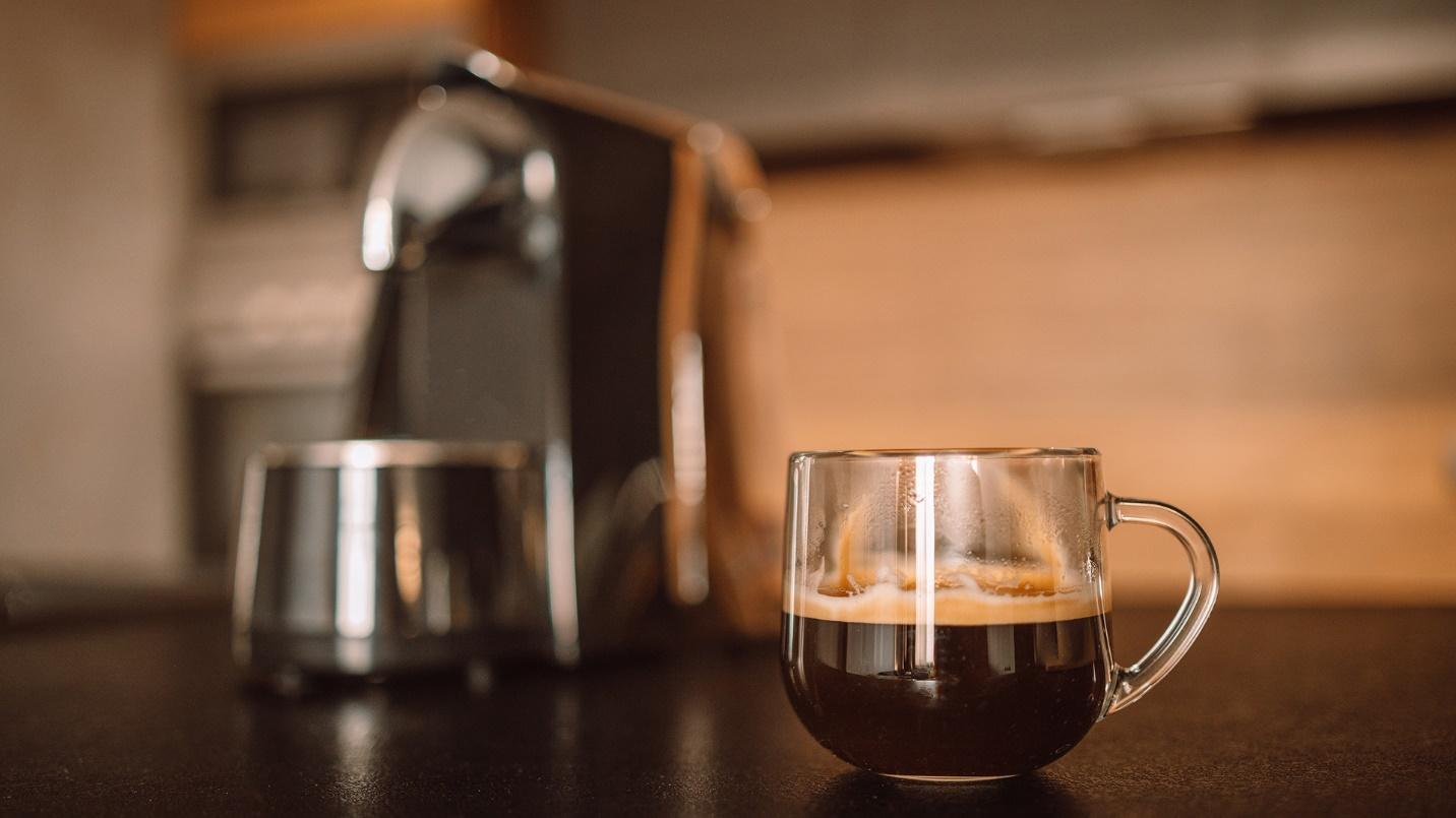 A glass mug filled with fresh black coffee in a section about the availability and quality of Puerto Rican coffee. 