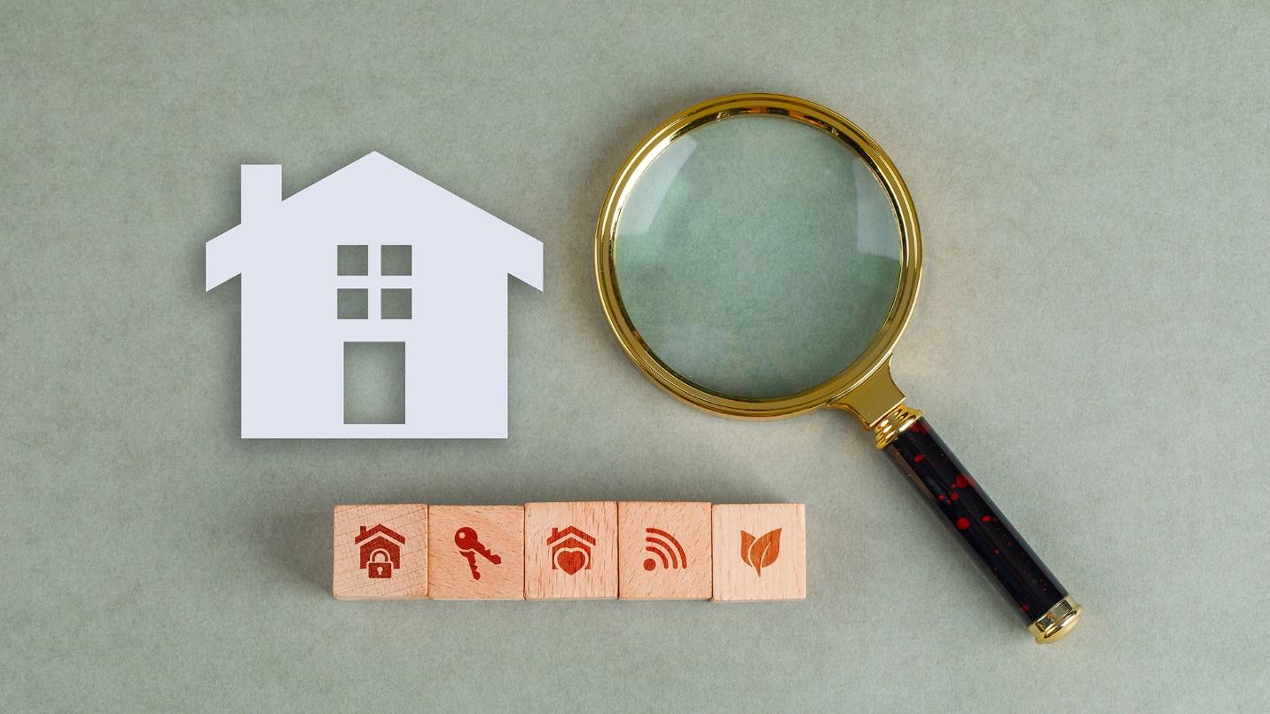 Housing icons and a magnifying glass against a gray background in a section that describes online resources and rental contracts for Puerto Rico rentals.