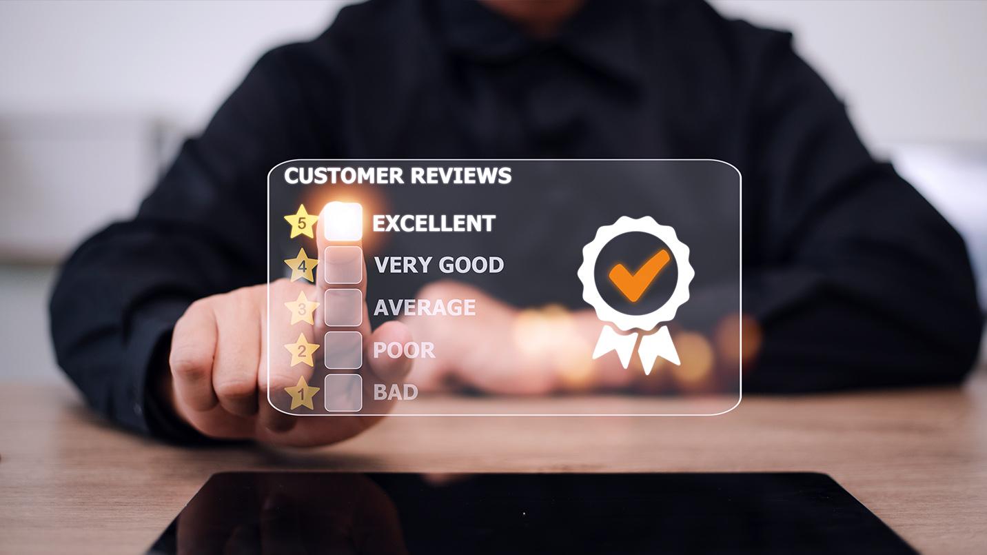 Hand selecting a five-star customer review rating on a digital screen, highlighting trusted wealth management services and positive client feedback for Act 60 advisors in Puerto Rico.