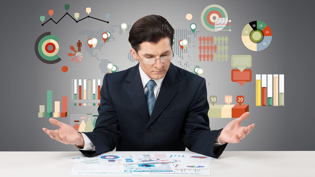 Business professional reviewing reports and data, illustrating financial analysis and compliance planning under Puerto Rico Act 60.