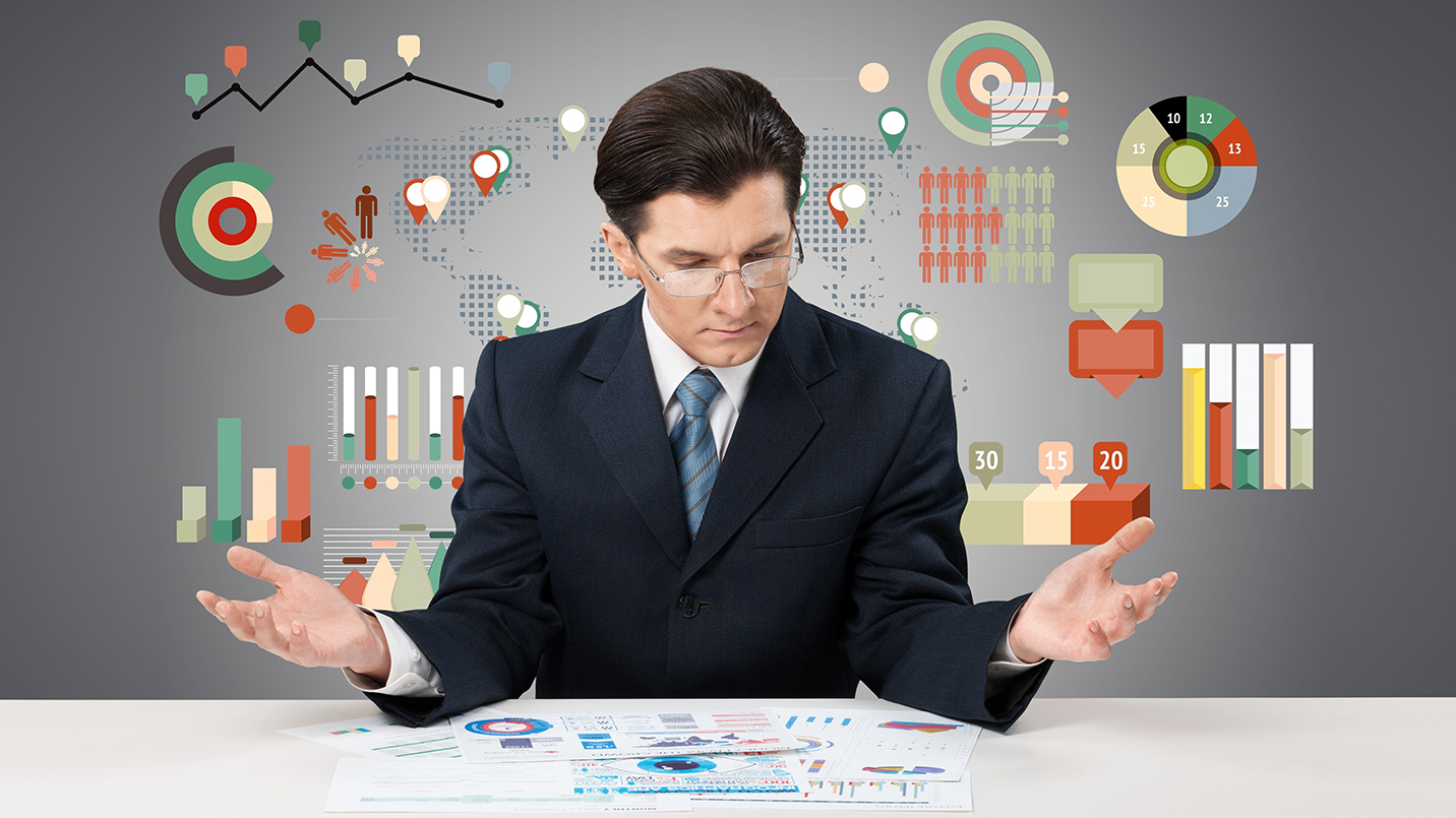 Business professional reviewing reports and data, illustrating financial analysis and compliance planning under Puerto Rico Act 60.